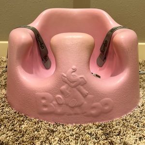 Pink Bumbo seat with attachment.
